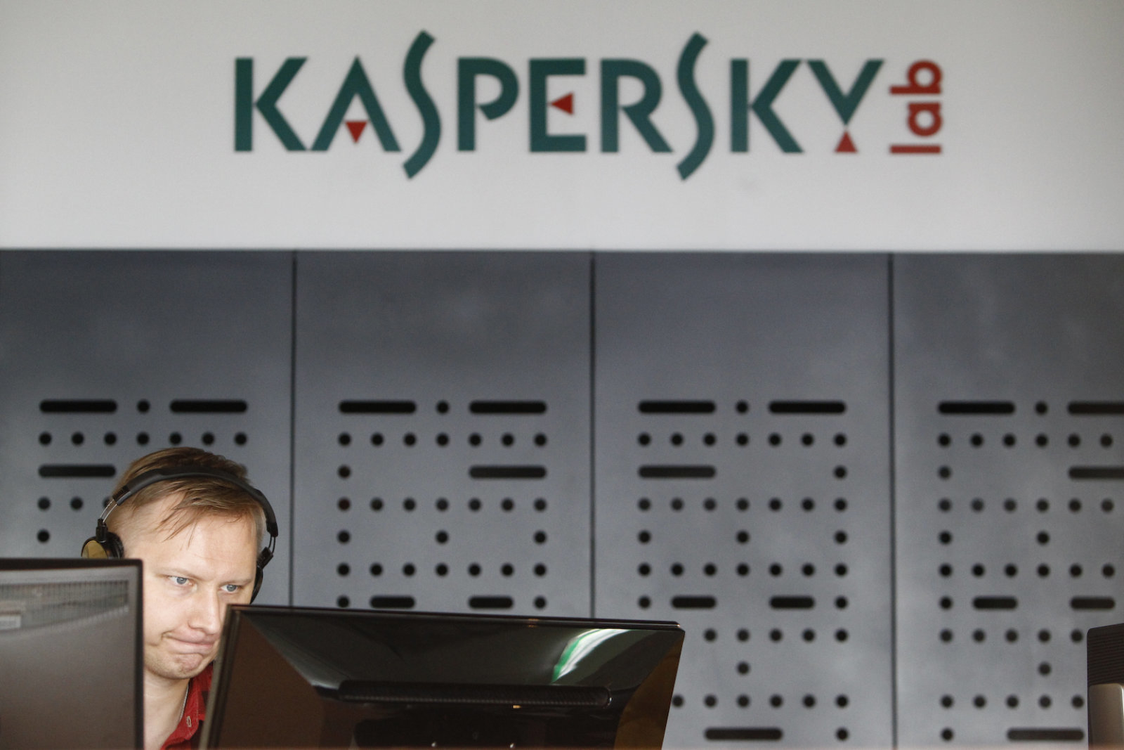 An employee works near screens in the virus lab at the headquarters of Russian cyber security company Kaspersky Labs in Moscow July 29, 2013. If you want to hack a phone, order a cyber attack on a competitor's website or buy a Trojan programme to steal banking information, look no further than the former Soviet Union. Picture taken July 29, 2013. To match Feature RUSSIA-CYBERCRIME/  REUTERS/Sergei Karpukhin (RUSSIA - Tags: SCIENCE TECHNOLOGY CRIME LAW BUSINESS)