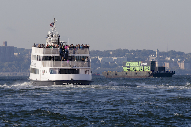 The GoDaddy barge travels up the Hudson River to promote the new .nyc internet domains, Wednesday, Oct. 8, 2014, in New York. (John Minchillo/AP Images for GoDaddy.)