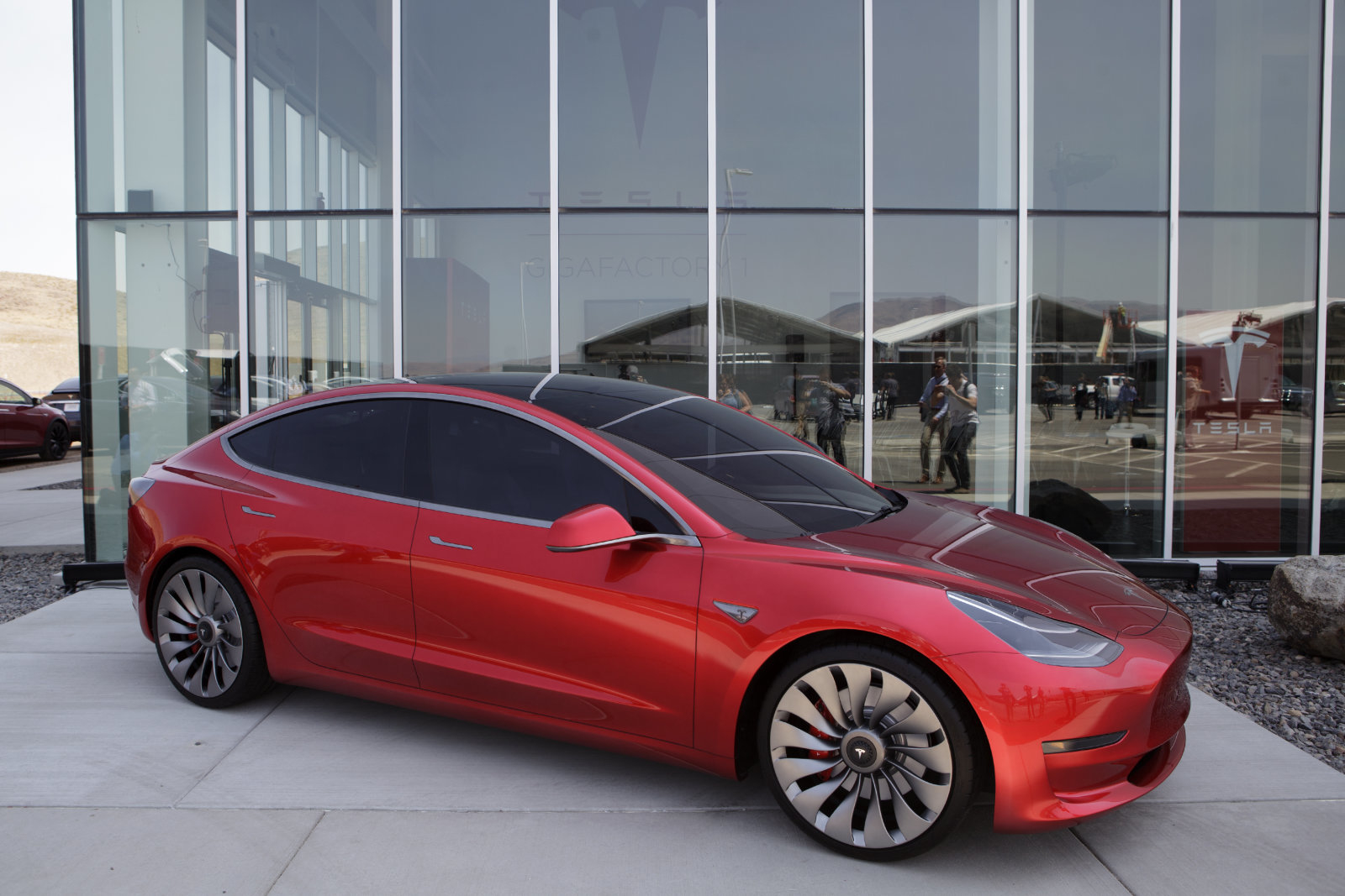 A Tesla Motor Inc. Model 3 vehicle is displayed outside the company's Gigafactory in Sparks, Neveada, U.S., on Tuesday, July 26, 2016. Tesla officially opened its Gigafactory on Tuesday, a little more than two years after construction began. The factory is about 14 percent complete but when it's finished, it will be about 10 million square feet, or about the size of 262 NFL football fields. Photographer: Troy Harvey/Bloomberg via Getty Images