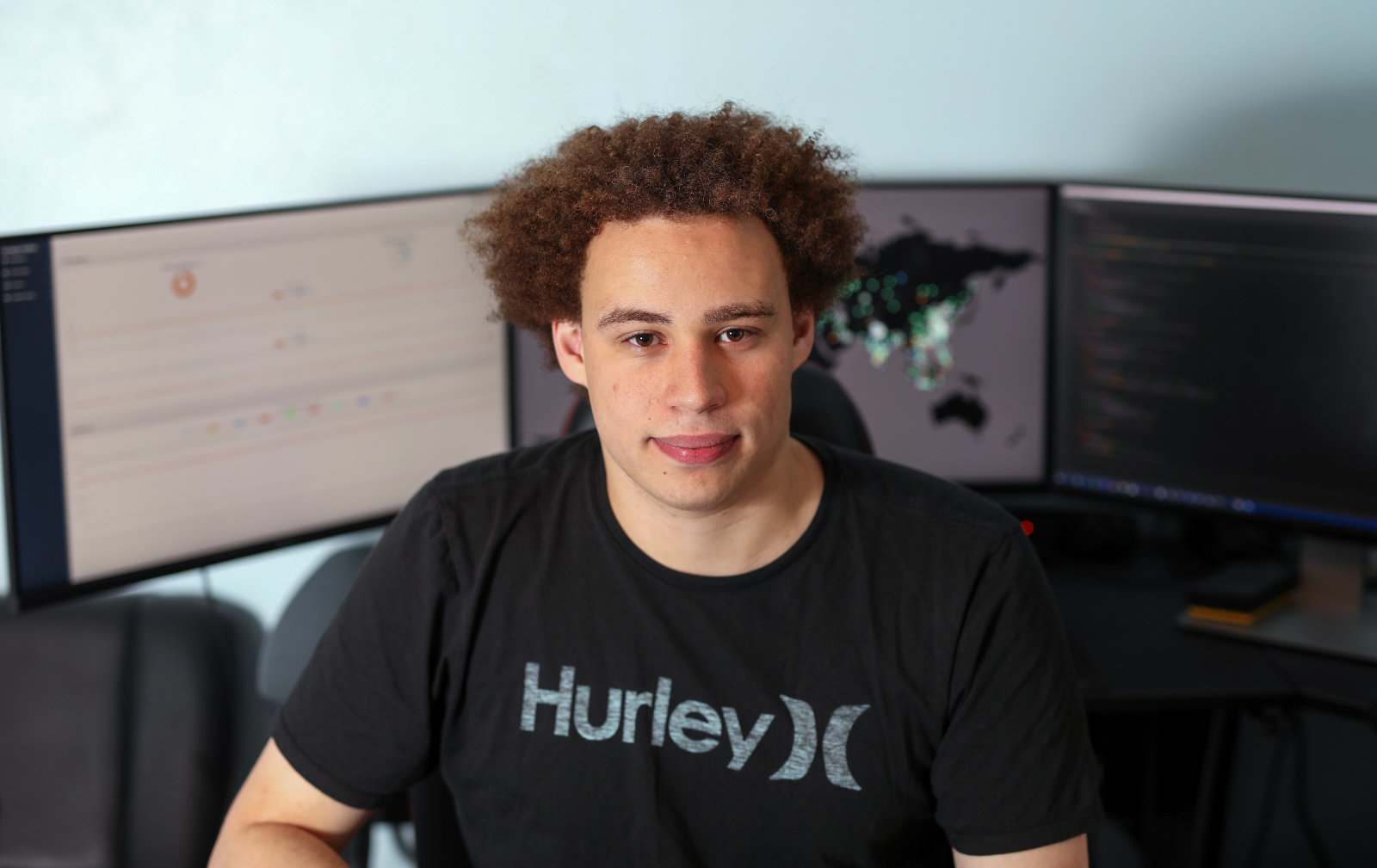 Marcus Hutchins, digital security researcher for Kryptos Logic, poses for a photograph in front of his computer in his bedroom in Ilfracombe, U.K., on Tuesday, July 4, 2017. Hutchins, the 23-year-old who saved the world from a devastating cyberattack in May was asleep in his bed in the English seaside town of Ilfracombe last week after a night of partying when another online extortion campaign spread across the globe. Photographer: Chris Ratcliffe/Bloomberg via Getty Images