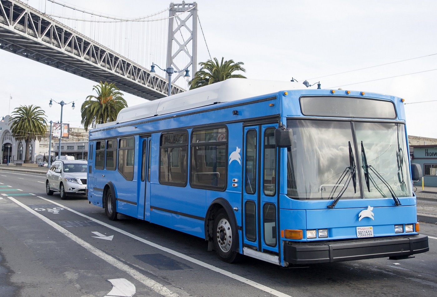 A Leap Transit bus drives passes under the Bay Bridge in San Francisco, California on March 23, 2015. Leap Transit's fleet of natural gas-powered luxury buses started their first route through the city this week, offering riders a new high-tech alternative to tightly packed city buses.  AFP PHOTO/JOSH EDELSON        (Photo credit should read Josh Edelson/AFP/Getty Images)