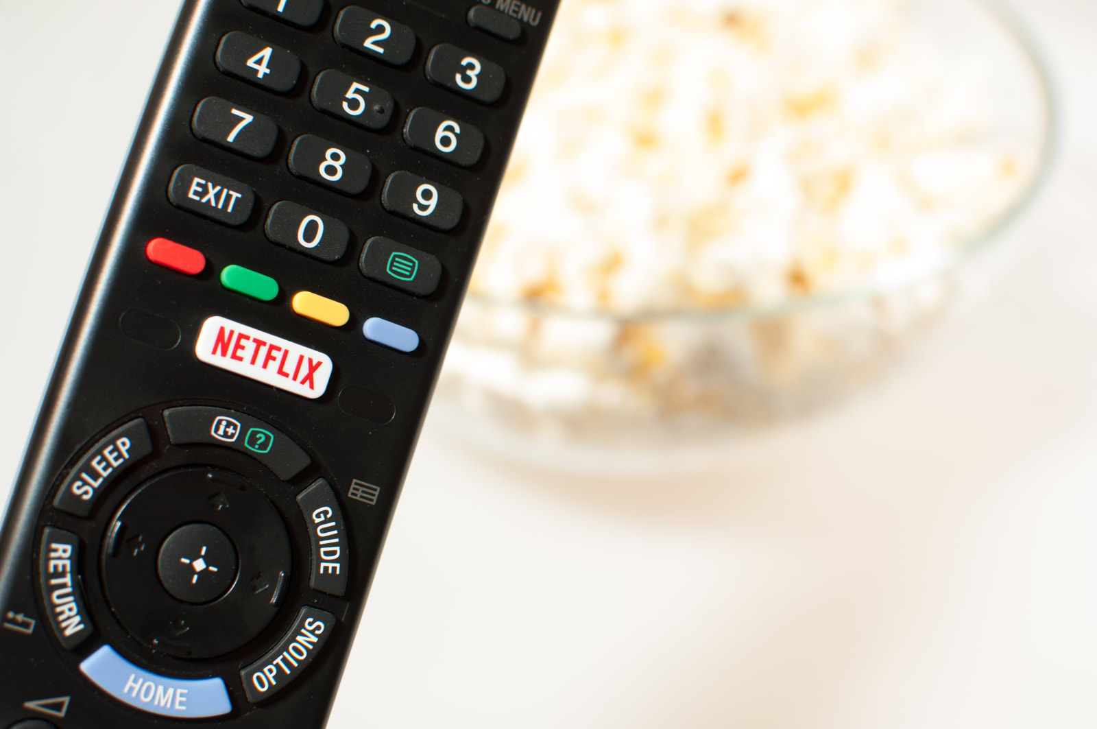 Remote control smart TV with Netflix button with popcorn.