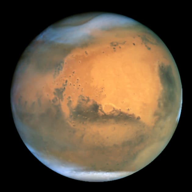 Frosty white water ice clouds and swirling orange dust storms above a vivid rusty landscape reveal Mars as a dynamic planet in this sharpest view ever obtained by an Earth-based telescope. The Earth-orbiting Hubble telescope snapped this picture on June 26, when Mars was approximately 43 million miles (68 million km) from Earth - its closest approach to our planet since 1988. Hubble can see details as small as 10 miles (16 km) across. Especially striking is the large amount of seasonal dust storm activity seen in this image. One large storm system is churning high above the northern polar cap [top of image], and a smaller dust storm cloud can be seen nearby. Another large duststorm is spilling out of the giant Hellas impact basin in the Southern Hemisphere [lower right]. Acknowledgements: J. Bell (Cornell U.), P. James (U. Toledo), M. Wolff (Space Science Institute), A. Lubenow (STScI), J. Neubert (MIT/Cornell)