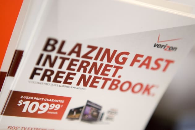 Brochures for Verizon FiOS and a free netbook sit inside a V