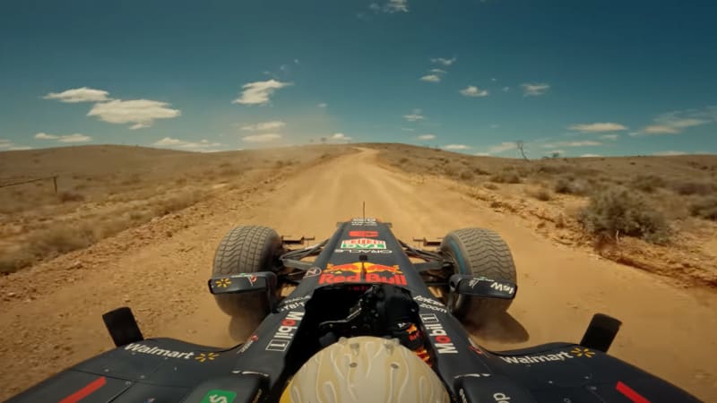 Daniel Ricciardo drives a Red Bull F1 car on an Australia road trip