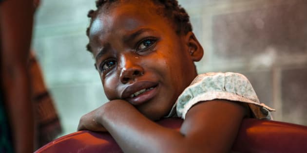 A girl cries outside the Bondeko morgue in Kinshasa, Congo, on Oct. 31, 2016.