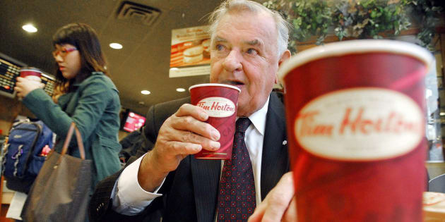 Ron Joyce, co-founder of Tim Hortons, sips a coffee in Toronto on Friday, October 20, 2006. Joyce has died at age age 88.