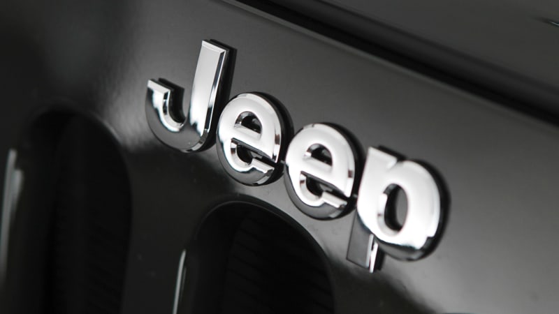the-jeep-badge-appears-on-the-grille-of-a-2011-wrangler-sahara-sport-picture-id104310519