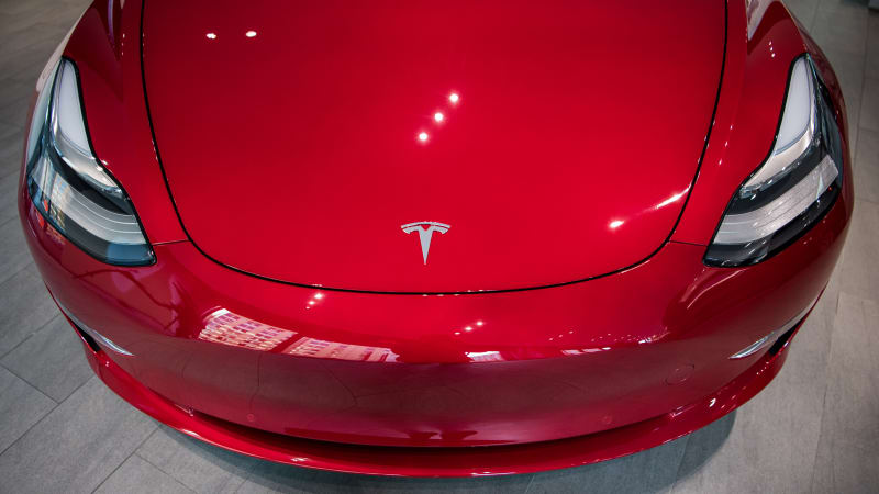 photo of Elon Musk agrees robot glut slowed Model 3 production image