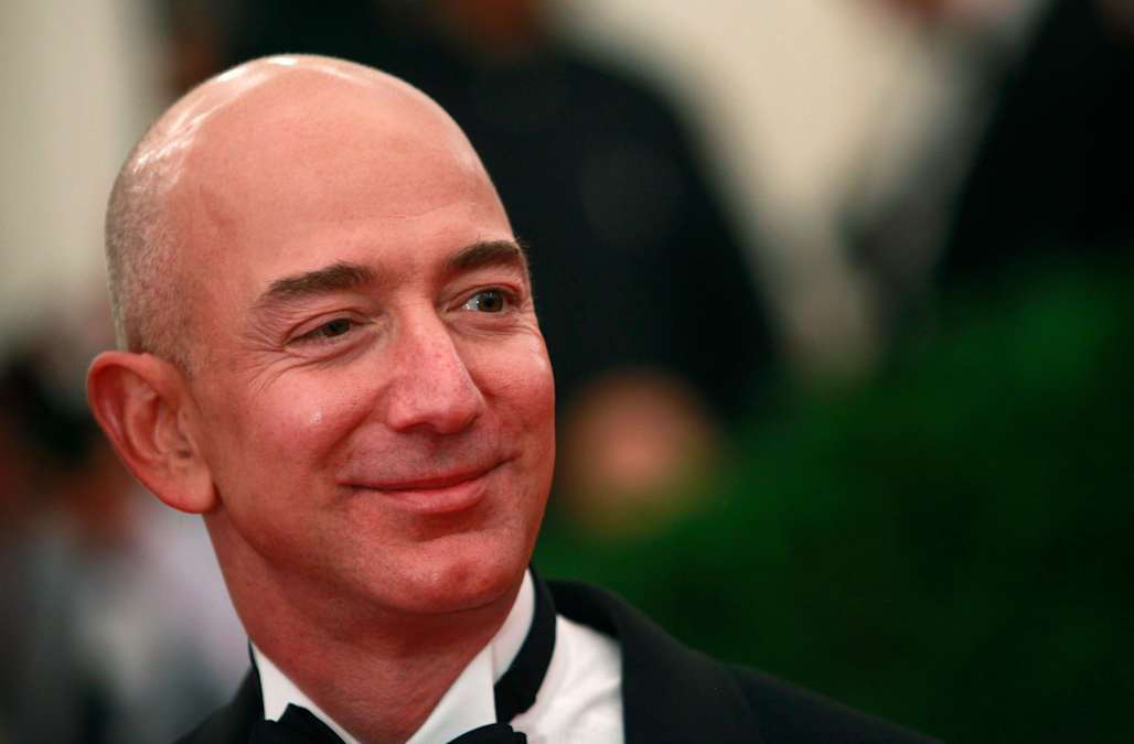 Jeff Bezos' updated net worth helps him retain status as ...