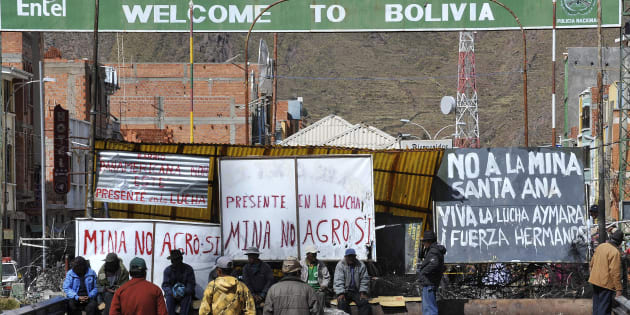 In this file photo taken May 24, 2011, Peruvian protesters block a bridge connecting Peru and Bolivia in Desaguadero, Peru, to oppose to the Canadian-owned Santa Ana silver mining project they said would pollute nearby lakes and rivers.