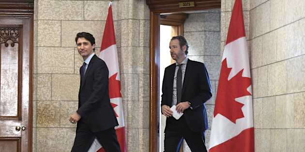 Prime Minister Justin Trudeau leaves his office with his principal secretary Gerald Butts to attend a cabinet meeting on Parliament Hill in Ottawa on April 10, 2018.
