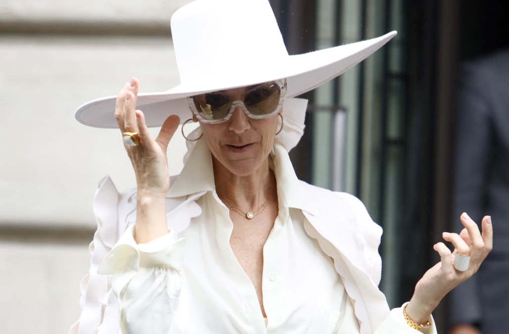 Celine Dion slays all-white couture jumpsuit in France -- see her regal ...