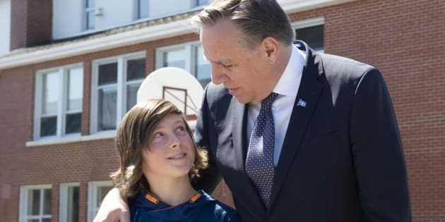 Quebec Premier Francois Legault meets sixth grader student James Paquet to announce the building of a new school after it was flooded by the Chaudiere River in Scott, Que. on May 6, 2019. 