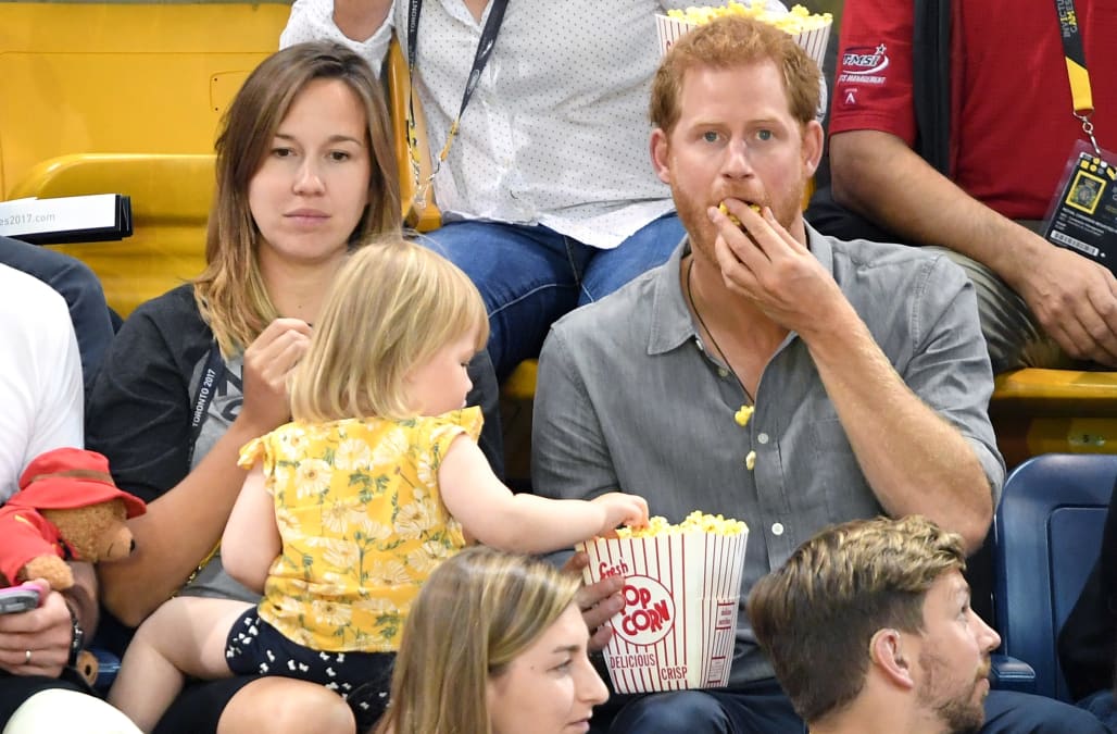 A toddler was sneakily stealing popcorn from Prince Harry ...
