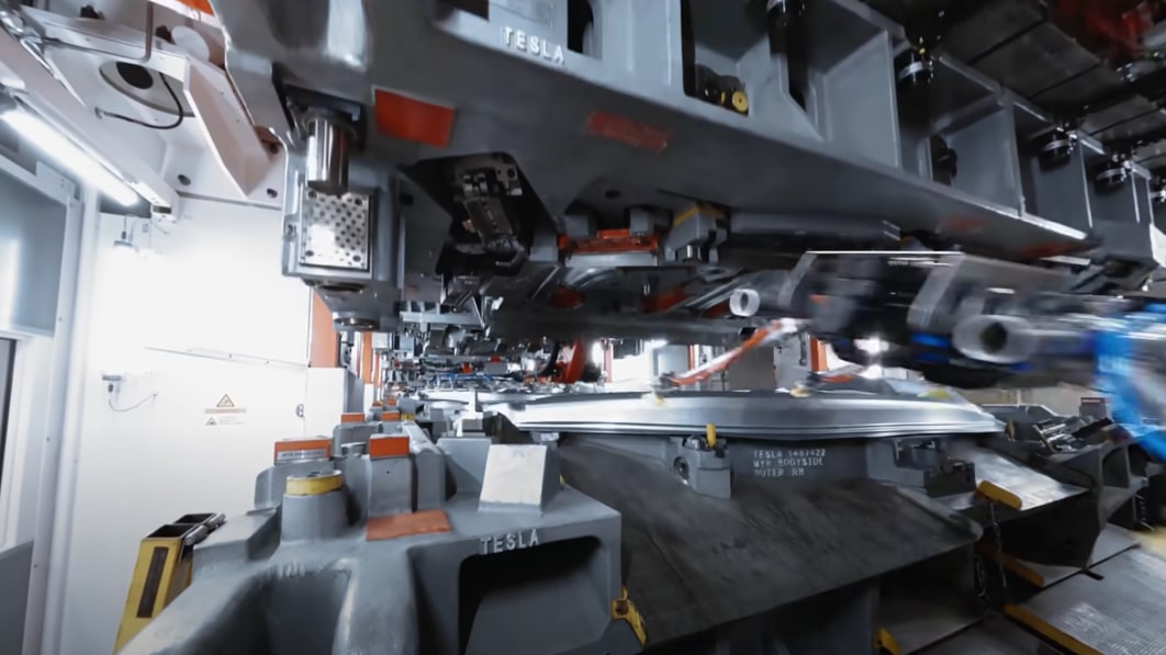 Fly through a stamping machine on a drone tour of Tesla Berlin plant