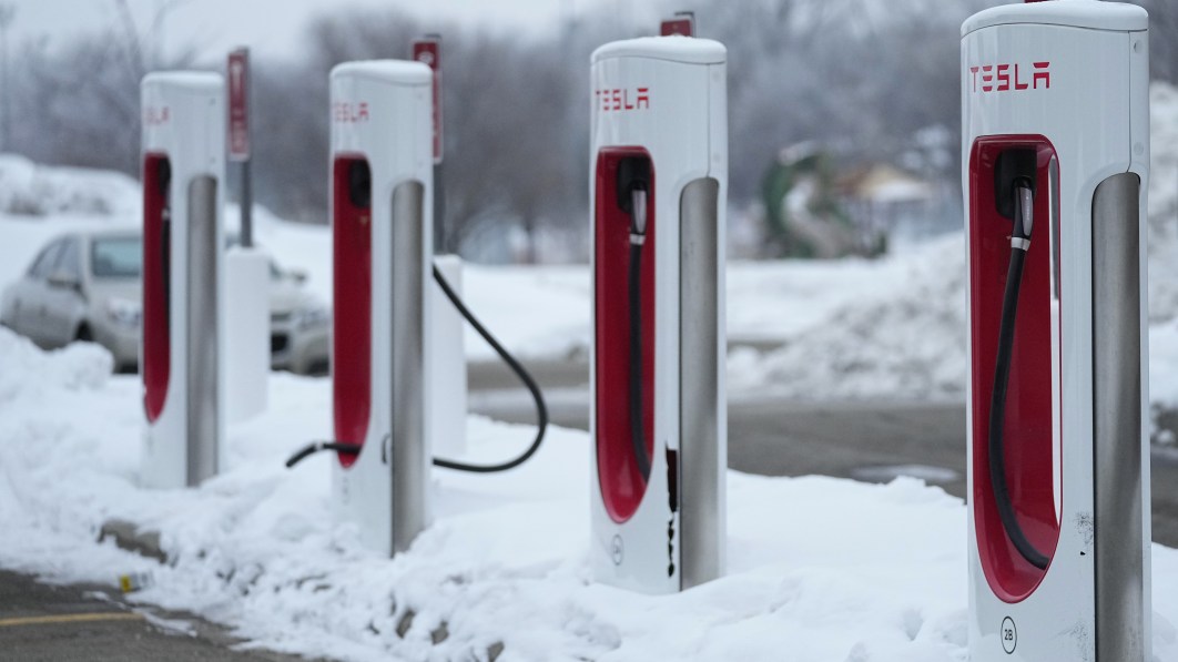 To tap U.S. government billions, Tesla must unlock EV chargers