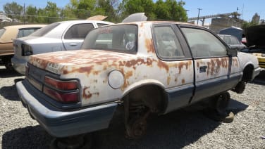 This junkyard '91 Grand Am is as hooptie as it gets