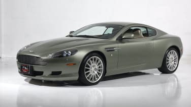 This Aston Martin DB9 with 104,000 miles on it makes us happy