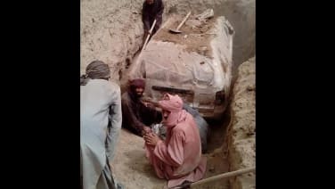 Taliban founder's Toyota Corolla dug up after spending 21 years buried