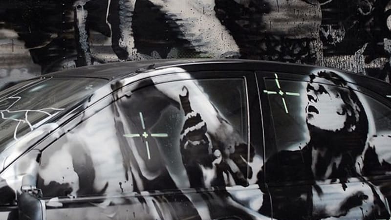 Graffiti artist Banksy turns Mazda Protege into warfare commentary
