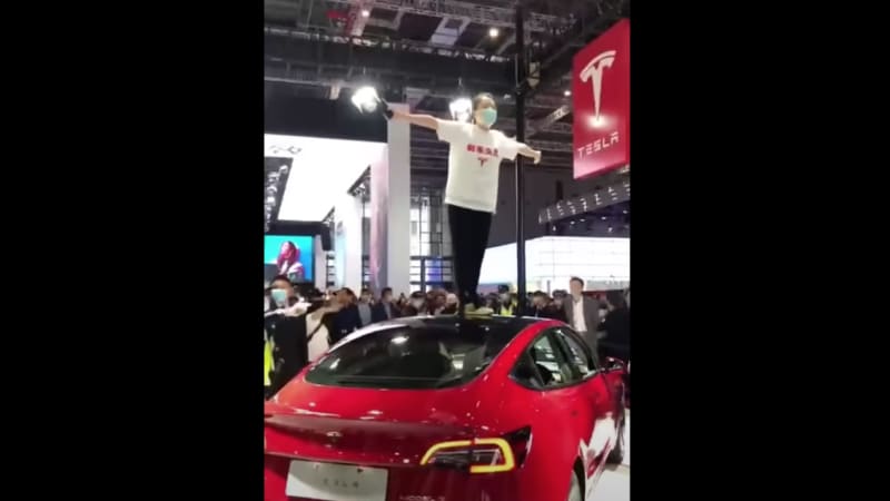 angry tesla owner storms display at shanghai auto show the brakes dont work