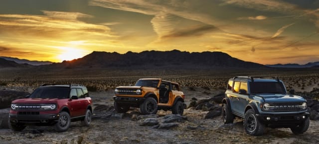 Pre-production versions of the all-new 2021 Bronco family of all-4x4 rugged SUVs, shown here, include Bronco Sport in Rapid Red Metallic Tinted Clearcoat, Bronco two-door in Cyber Orange Metallic Tri-Coat and Bronco four-door in Cactus Gray. 