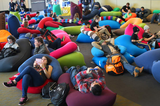 BOSTON - MARCH 6: The huge PAX East gaming convention was held at the Boston Convention and Exhibition Center. Tired convention-goers relax on cushions on the floor. (Photo by John Tlumacki/The Boston Globe via Getty Images)