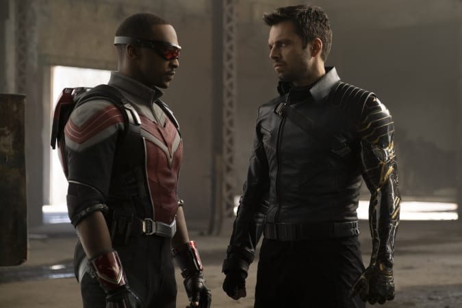 The Falcon (Sam Wilson) and the Winter Soldier (James Barnes) stand in front of each other.
