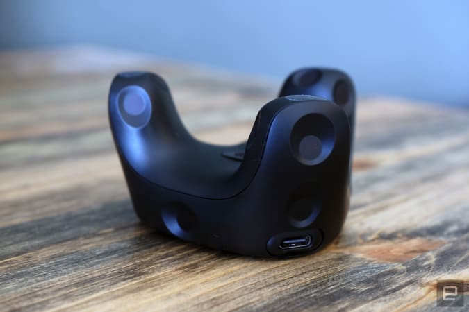 Image of HTC's Vive Tracker 3.0 placed on a table, exposing its USB-C side.