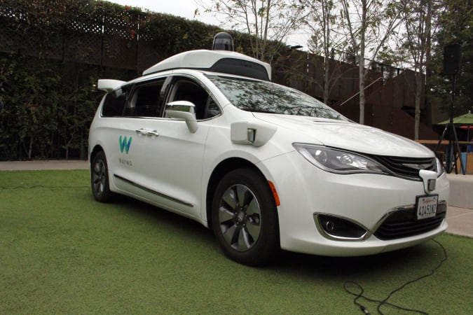 A Waymo self-driving car pulls into a parking lot at the Google-owned company's headquarters in Mountain View, California, on May 8, 2019. (Photo by Glenn CHAPMAN / AFP)        (Photo credit should read GLENN CHAPMAN/AFP via Getty Images)