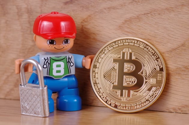 Look at this smug Lego man with his bitcoin. Who told him to invest? 