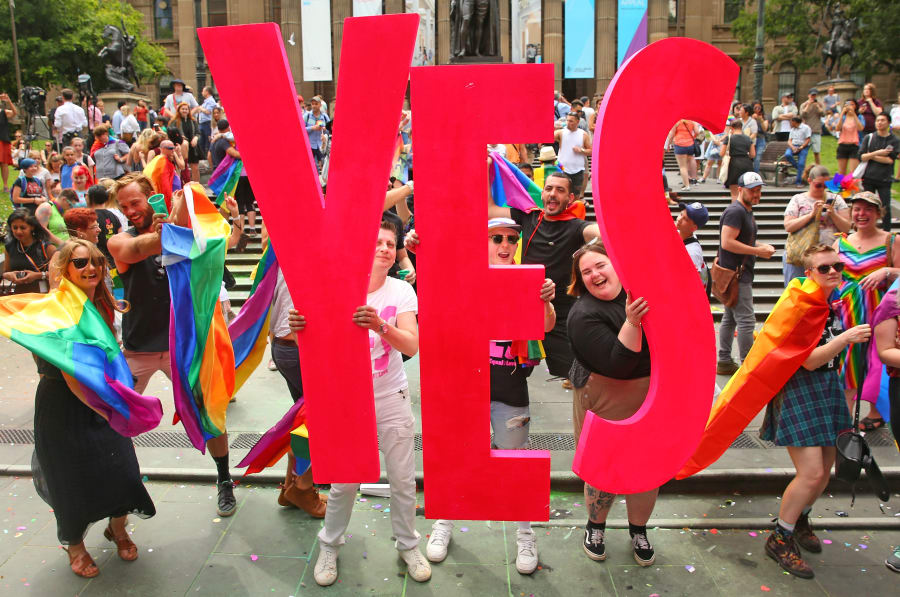 Melbourne, Australia -- November 15: That's a big fat YES! People in the crowd celebrate as the result is announced at the State Library of Victoria.