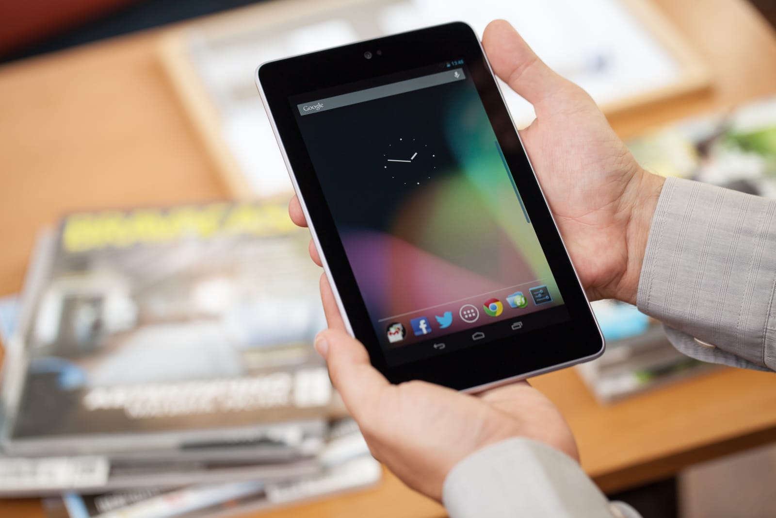 Man holding Google Nexus 7 digital tablet