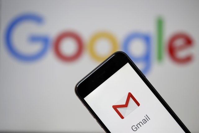 PARIS, FRANCE - JULY 04: In this photo illustration, the logo of the Gmail app homepage sometimes appears on the screen of an iPhone before some type of computer screen showing a Google logo on July 04, 2018 in Paris, France. Based on the Wall Street Journal a large number of Google partner companies get access to emails from 1.5 billion Gmail users. Gmail is really a free email service provided by Google. (Photo Illustration by Chesnot/Getty Images)