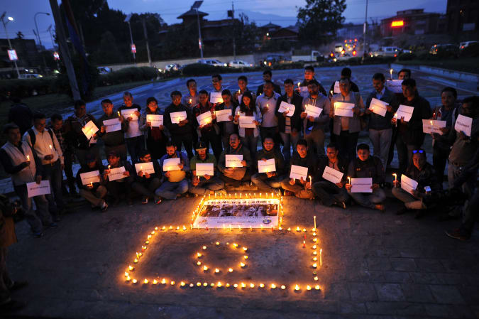 Nepalese journalists and photojournalists lit candles to pay tribute to journalists killed in the Kabul attack in Kathmandu, Nepal on Wednesday, May 2, 2018. The program was jointly organized by the Nepal Photojournalist Club and the Federation of Nepalese Journalists (FNJ).  (Photo by Narayan Maharjan / NurPhoto via Getty Images)