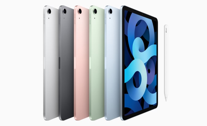 Six Apple iPad Air tablets all lined up showing the variety of color options.