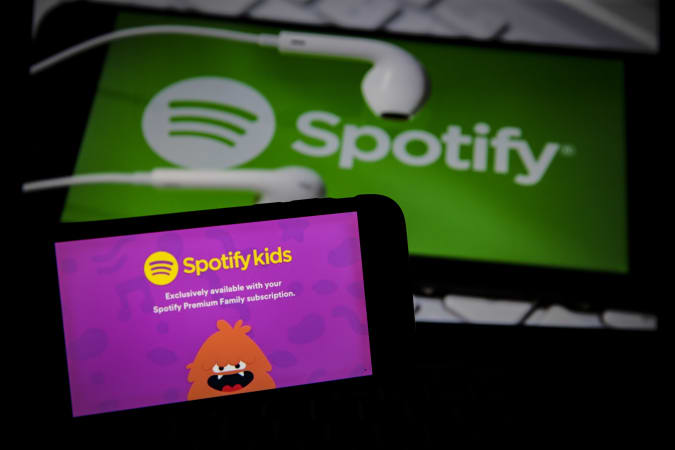 ANKARA, TURKEY - MAY 22: The Spotify children's logo appears on the smartphone in front of the Spotify logo in Ankara, Turkey on May 22, 2020. Metin Aktas / Anadolu Agency