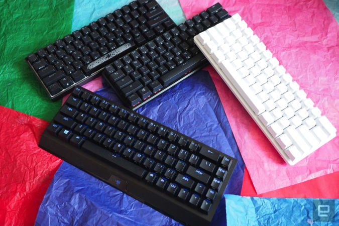 60-percent keyboards on a bed of colored paper