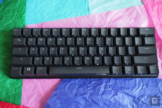 HyperX Alloy Origins 60 in black on a bed of colored paper