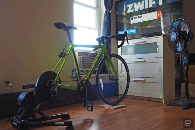 An in-home setup for Wahoo Kickr Smart and Zwift showing a bike and TV.
