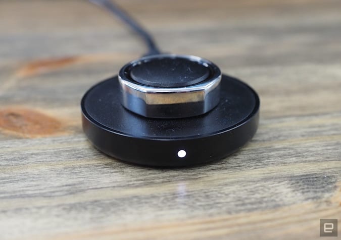 Image of the Oura Ring V3 on its charging plate.