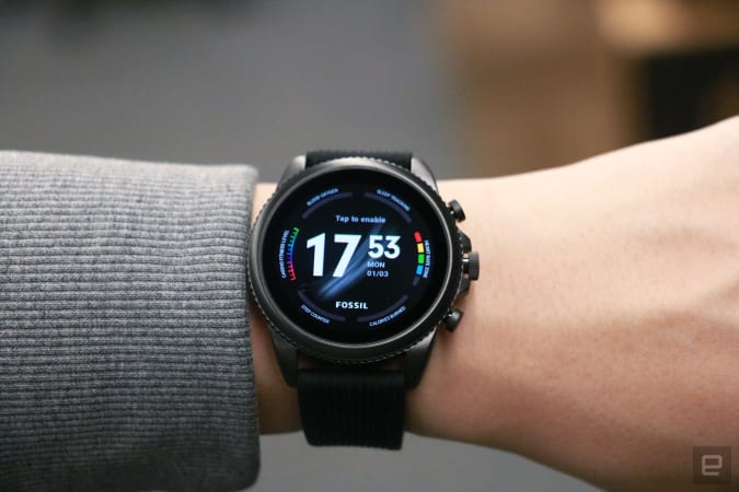 The Razer x Fossil Gen 6 smartwatch with black straps on a wrist and the exclusive Wellness watch face. 