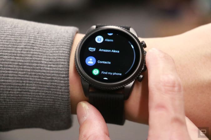 The Razer x Fossil Gen 6 smartwatch shows a list of apps with a name, with a black strap on the wrist 