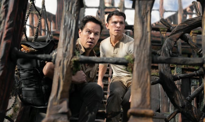Tom Holland as Nathan Drake, Mark Wahlberg as Sully in the Uncharted movie.