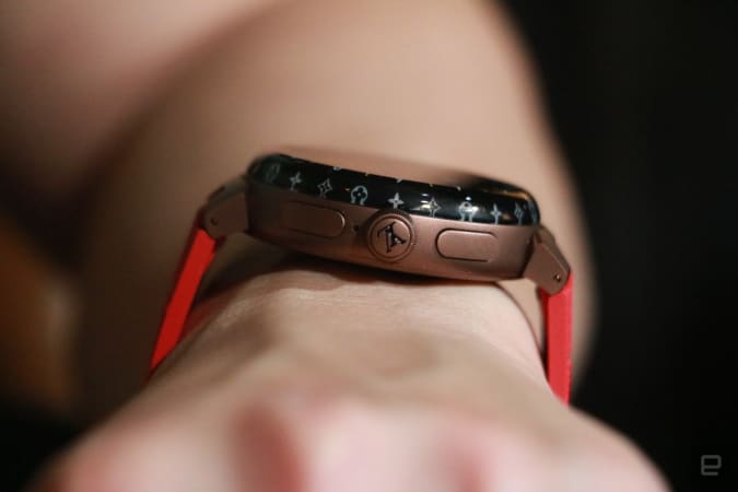 A side view of the Louis Vuitton Tambour Horizon Light Up smartwatch with the company logo on the dial and two other buttons on the edge.