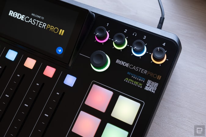 A close-up of the top right corner of the Rodecaster Pro II where the headphone volume controls are shown by colored LEDs.