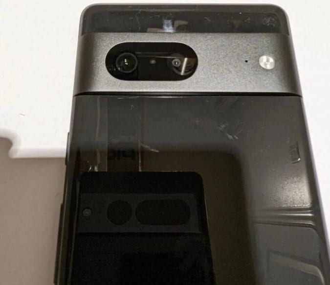 The rear of a purported Pixel 7 with what seems to be a Pixel 7 Pro in the reflection