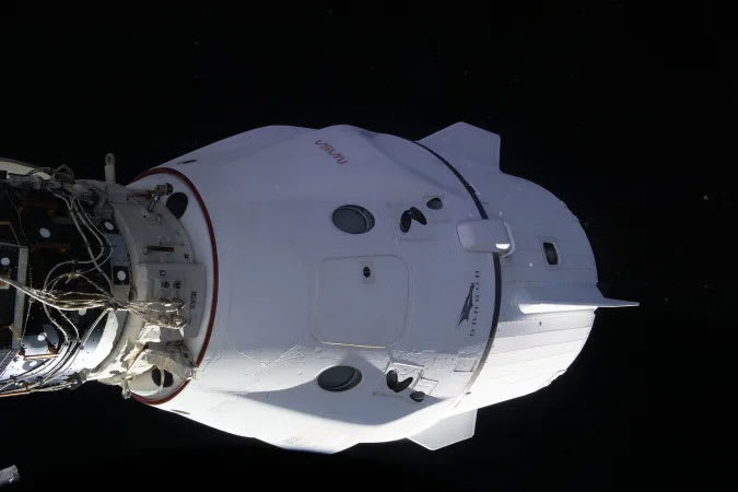 Image of a SpaceX crew capsule docking with the ISS.