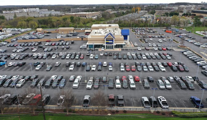 GAITHERSBURG, MARYLAND - APRIL 12: In an aerial view, a CarMax lot holds hundreds of used cars and trucks on April 12, 2022 in Gaithersburg, Maryland.  Consumer prices rose 8.5 percent in the year through March 2022, reaching the fastest inflation rate since 1981 with the US average for a gallon of regular gas peaking at $4.33 on March 11. (Photo by Chip Somodevilla/Getty Images)